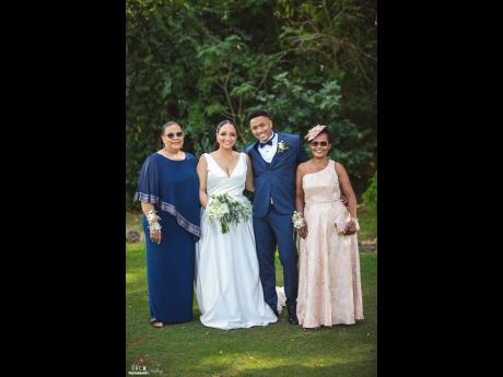 Danielle and Arillon are joined by their parents, mother of the bride Sonia Levy (left) and grandmother of the groom. 