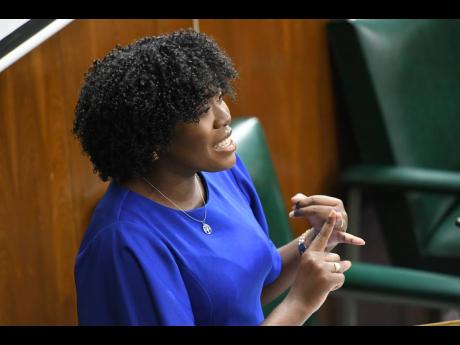 Karyl Thorpe, representative of St Catherine South Eastern, addresses the 12th sitting of the National Youth Parliament at Gordon House in Kingston on Monday.