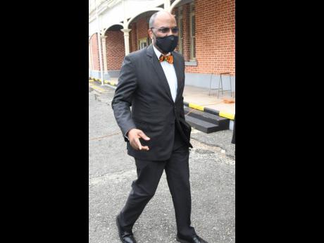 
A sharply dressed Earl Jarrett, chief executive officer of The Jamaica National Group and patron of The Mico University College Alumni Association (MOSA), makes his way to the courtyard of The Mico University College, where the ceremony launching the inst