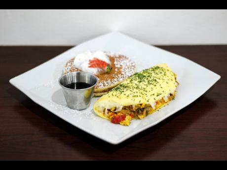 It’s an American breakfast meets Jamaican breakfast with this ackee and salt fish omelette served with pancakes.