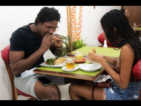 Loyal First Bite customers Daniel Perry (left) and Monique Smith agree that breakfast is the most important meal of the day, because it breaks fasts and adds energy for conversation.