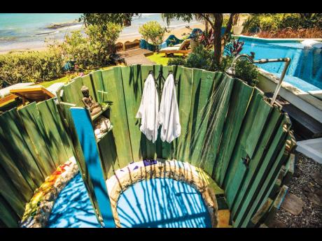 A circular  outdoor shower that leaves your head spinning in awe.