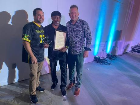 From left:  Josh Levy, mayor of the City of Hollywood; Tanto Irie, DJ and host of Reggae Runnins on HOT 105 FM in South Florida who was honoured for his  21 years service in media and Jamaica’s Miami Consul General Oliver Mair.