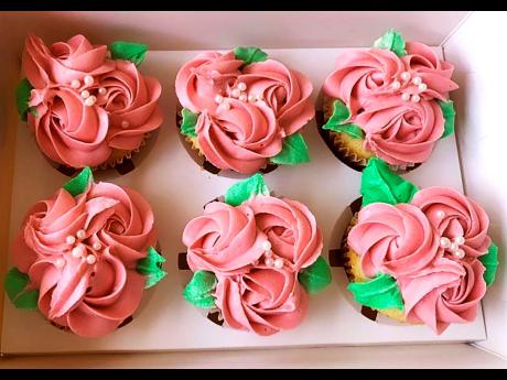 Classic vanilla cupcakes topped with buttercream rose petals. 