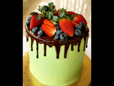 Take your taste buds on a sweet ride with this the chocolate Baileys cake with chocolate ganache filling, topped with blueberries and strawberries.