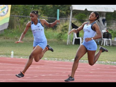 
Edwin Allen’s Tina Clayton collects the baton on the final leg of the class I girls 4x100-metre relay at  Western Relays held at G.C. Foster college on Saturday, February 12 2022.