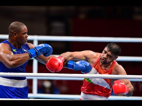 
Jamaica’s Ricardo Brown (left) competing in the men’s super heavy +91kg preliminaries at the Tokyo 2020 Olympics at Kokugikan Arena in Tokyo, Japan on Thursday, July 29, 2021. 