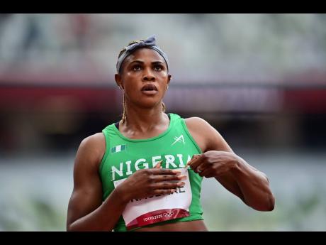 
Blessing Okagbare looks at the replay screen inside the stadium after competing in the women’s 100m heats on Friday, July 30, 2021, at the Tokyo 2020 Olympic Games. 
