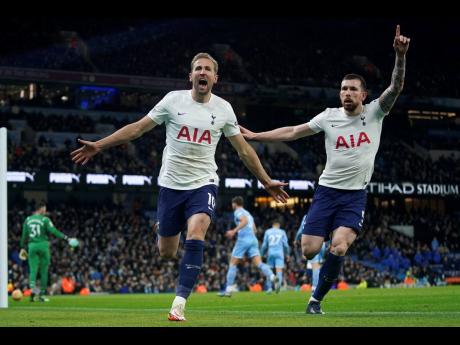 
Tottenham’s Harry Kane (left) celebrates with Tottenham’s Pierre-Emile Hojbjerg after scoring his side’s second goal during the English Premier League football match between Manchester City and Tottenham Hotspur, at the Etihad stadium in Manchester,