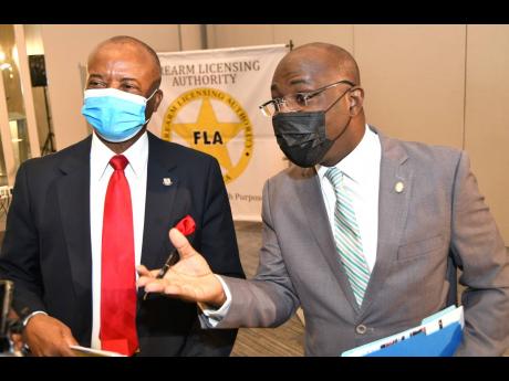 
Retired army Colonel Audley Carter (left), chairman of the Firearm Licensing Authority, and CEO Shane Dalling revealed several bombshells regarding the agency during a press briefing last week.