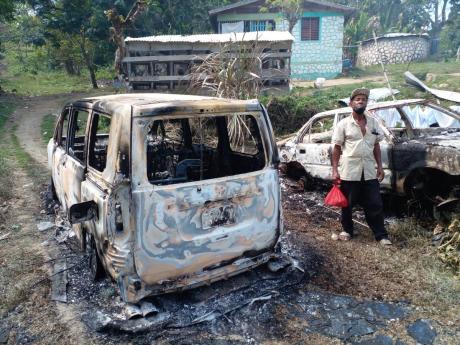 A house and two vehicles were completely destroyed after they were shot up and set ablaze in the early hours of yesterday morning in the Belvedere community called Scott Land in Bethel Town, Westmoreland. Six family members were left homeless.
