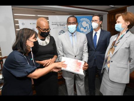 From left: Mariko Kagoshima, country representative, United Nations Children’s Fund; Education Minister Fayval Williams; Finance and the Public Service Minister Dr Nigel Clarke; Timothy Johnson, human development programme leader for the Caribbean, World