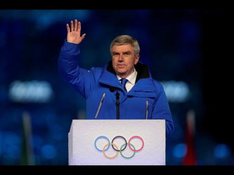 International Olympic Committee President Thomas Bach waves during the closing ceremony of the 2022 Winter Olympics on Sunday, February 20, 2022, in Beijing. 