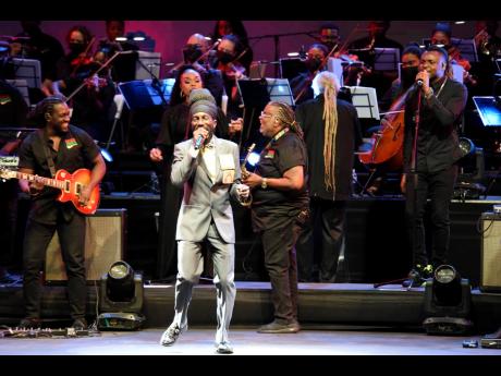 

Reggae artiste Sizzla Kalonji performs inside the National Indoor Sports Centre – accompanied by a 35-piece orchestra – with Ibo Cooper as conductor and Dean Fraser as musical director. 