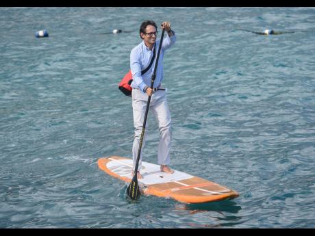 With his bag on his back carrying his cellular phone, laptop and shoes, Mais says travelling to work via paddleboard is like ‘riding a bike’.