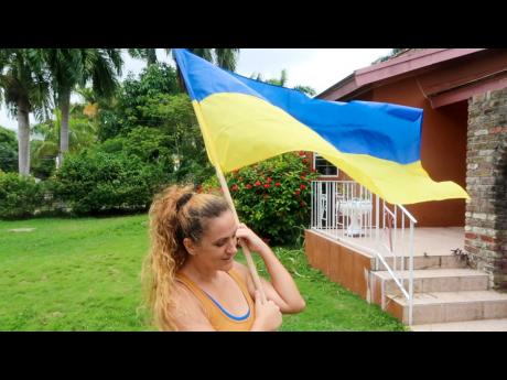 “I was shaking, and it was very difficult to stop,” said Irina Bruce, Ukrainian journalist who has been living in Jamaica for the past eight years, of news that Russia had launched an attack on her homeland.