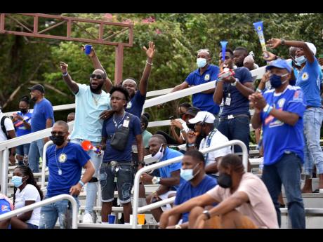 
Mount Pleasant fans celebrate an Allan Ottey goal during the team’s top-of-the-table Jamaica Premier League clash against Waterhouse at the Drax Hall Sports Complex yesterday. 