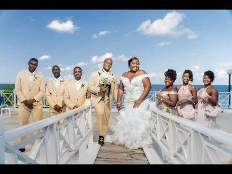 Mr and Mrs Rowe were in high spirits alongside their dedicated bridal party. From left: groomsmen O’Shane Ingram and Kevin Beckford, best man Jermaine Jackson, maid of honour Denica Daley, and bridesmaids Chantelle Vaz and Channay Mundle-Henry.
