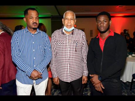 From left: Producer Lloyd ‘John John’ James poses with his father Lloyd ‘King Jammy’ James and Romeo Facey.