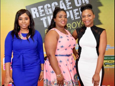 From left: Litania Baker, Natakie Topping-Ellis and Giselle Atkins were all smiles while attending the watch party at The Jamaica Pegasus hotel on Sunday.