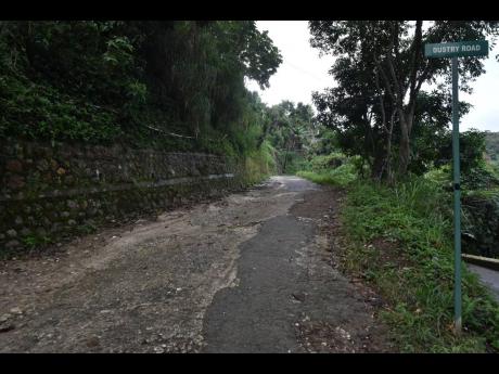 Dustry Road in St Andrew East Rural that is stated for repair.