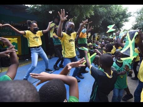 Students of Maxfield Park Primary School in St Andrew perform the different Jamaican dance moves while celebrating Jamaica Day at their school on February 25.