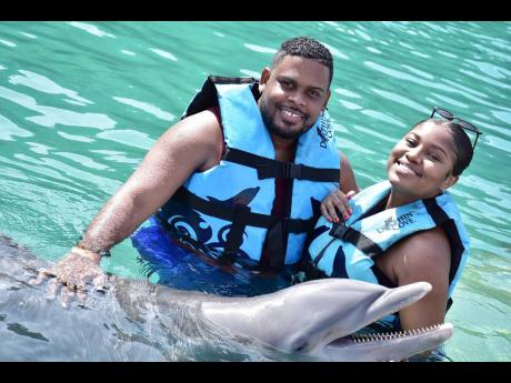 Hakeem and Kimberley enjoyed swimming with the dolphins at Dolphin Cove in Ocho Rios, St Ann. 