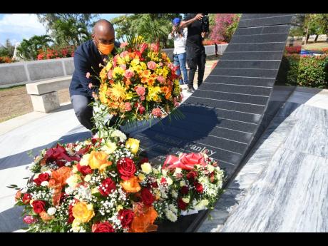 Julian Robinson lays a wreath at the People’s National Party Region 3 executive and party leadership 25th anniversary commemoration of the passing of Michael Manley at the National Heroes Park on March 6.