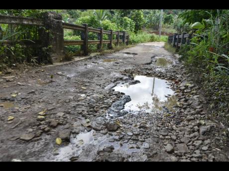 A section of the Gayle main road which is in need of repair.