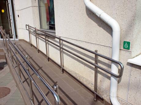 A ramp for wheelchair users outside an office.