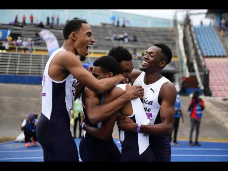 Jamaica College’s 4X800 metres relay team celebrates a record breaking run at the recent Gibson McCook Relays held at the National Stadium.