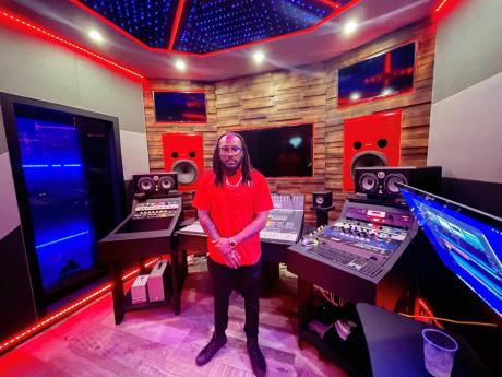 Anju Blaxx stands inside the main production room of his recently opened Black State Studio. 