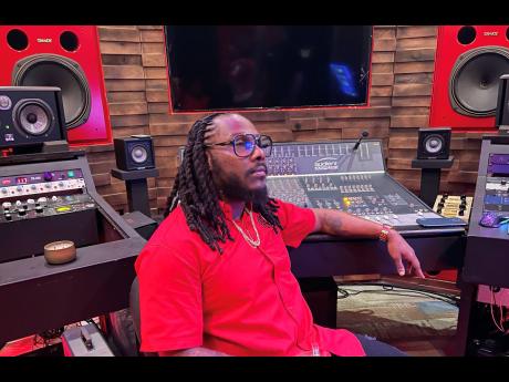 Andrew Myrie, known professionally as record producer and songwriter Anju Blaxx, takes a moment of silence in remembrance of his father who bought one of his most prized possessions, his Audient mixing board.