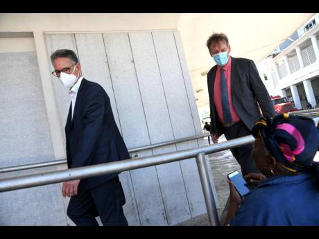 Rudolph Brown/Photographer
Gerard Borhols (left) and Ronald Steen, Dutch investigators from the Central Authority of The Netherlands, enter the Supreme Court for the Trafigura hearing last week. 