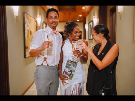 The newly-weds raise a toast to their wedding planner, Kimberley Dunkley Watkins of Dragonfly Experiences.