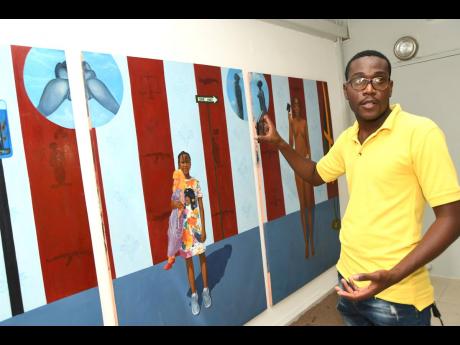Malcolm Lindsay, police constable and a self-taught visual artist, shows off his work at Creative Space, Windsor Avenue, St Andrew, last week Friday.