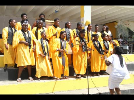 The Garvey Maceo High School choir performs in tribute to Ann-Marie Robb on Sunday.