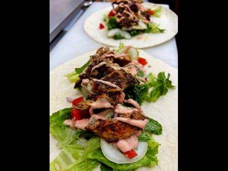 This wrap is chok-full of tasty goodness, including jerk chicken. 