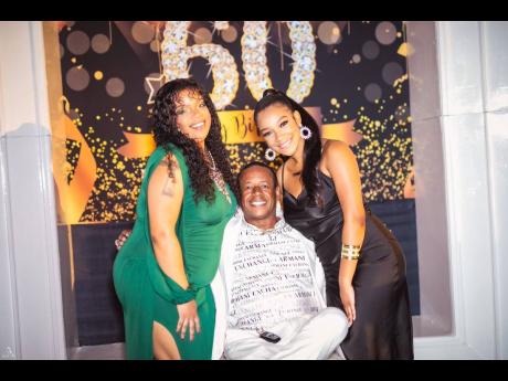 The birthday boy is sandwiched by his beautiful daughters – Savanna (left) and Tiffany. 