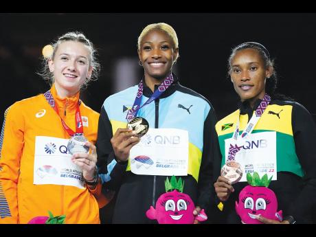 From left: Silver medallist Femke Bol, of the Netherlands, gold medallist Shaunae Miller-Uibo, of Bahamas, and bronze medallist Stephenie Ann McPherson, of Jamaica, pose with their medals on the podium of the Women’s 400 metres at the World Athletics Ind