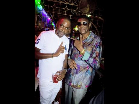 Stone Love founder and CEO, Winston ‘Wee Pow’ Powell (left), and son Duane. Wee Pow celebrated his birthday on Saturday at the sound system’s Burlington Avenue headquarters.  