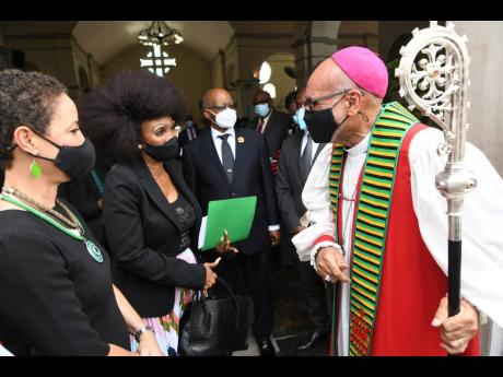 Rev Howard Gregory (right), Archbishop of the West Indies and Bishop of Jamaica and The Cayman Islands greet (from left), Senator Kamina Johnson-Smith, minister of foreign affairs and foreign trade; L.E. Yegeni, High Commissioner of South Africa; Kenneth H