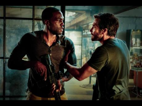 Yahya Abdul-Mateen II (left) and Jake Gyllenhaal in the action thriller ‘Ambulance’.