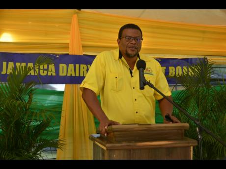 Derrick Deslandes, chairman of the Jamaica Dairy Development Board, makes a call for young people to be more involved in the development of Jamaica’s agricultural sector, including the dairy-production sector, during the official handover of a mobile mil