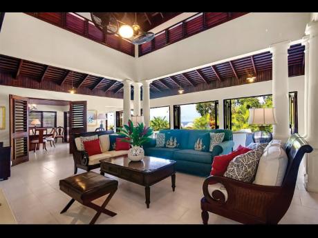 The living room gives you incredible views of the golf course and sea nearby.