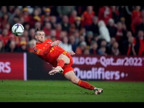 AP
Wales’ Gareth Bale takes a shot during the World Cup 2022 play-off soccer match between Wales and Austria at Cardiff City stadium, in Cardiff, Britain, on Thursday.