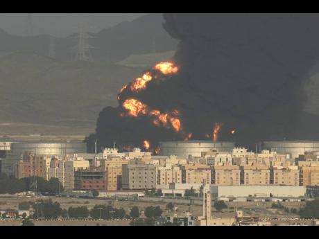 AP
A fire at an oil depot in the kingdom rages during practice ahead of today’s Formula One Grand Prix in Saudi Arabia. 