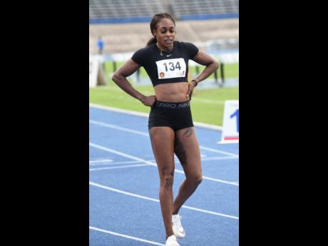 
Elaine Thompson Herah just after completing a 400 metre run during the John Wolmer Speedfest at the National Stadium yesterday.