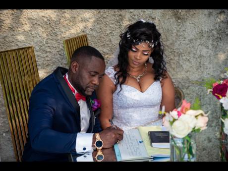 That moment when Andrew and Latania make things official by signing the papers to become husband and wife.