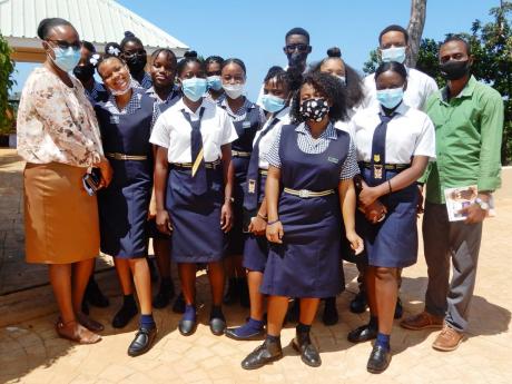 Teachers from the Human Ecology Department at St Elizabeth Technical High School, Dian Young (left) and Harane Samuels (right), with students from the school, at the Culinary Arts and Gastronomy Symposium in Runaway Bay, St Ann. 